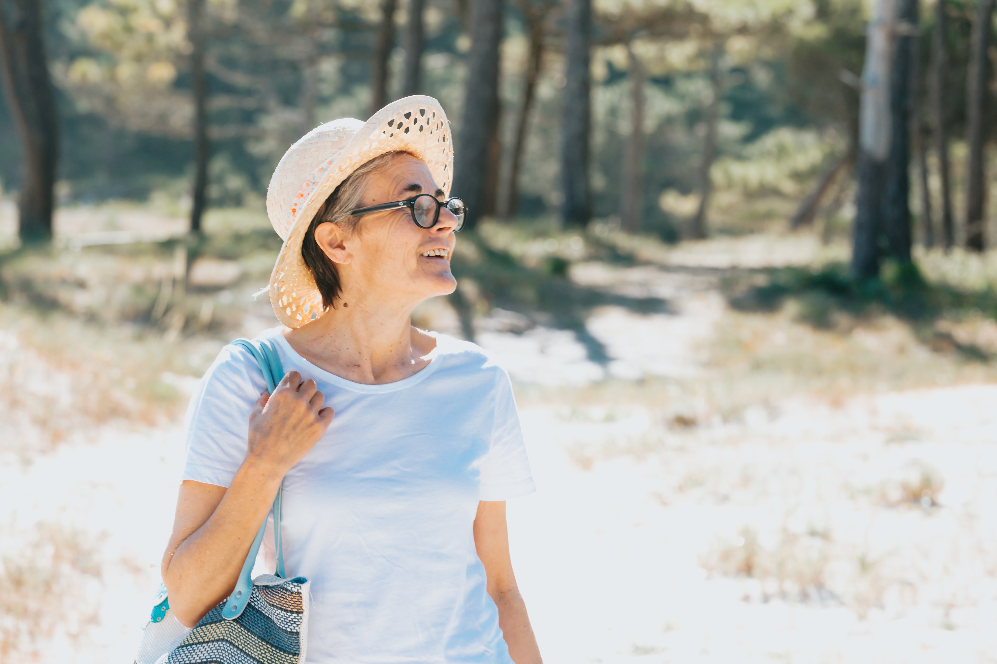 files/woman-walks-outdoors-during-summer-holding-a-beach-bag.jpg